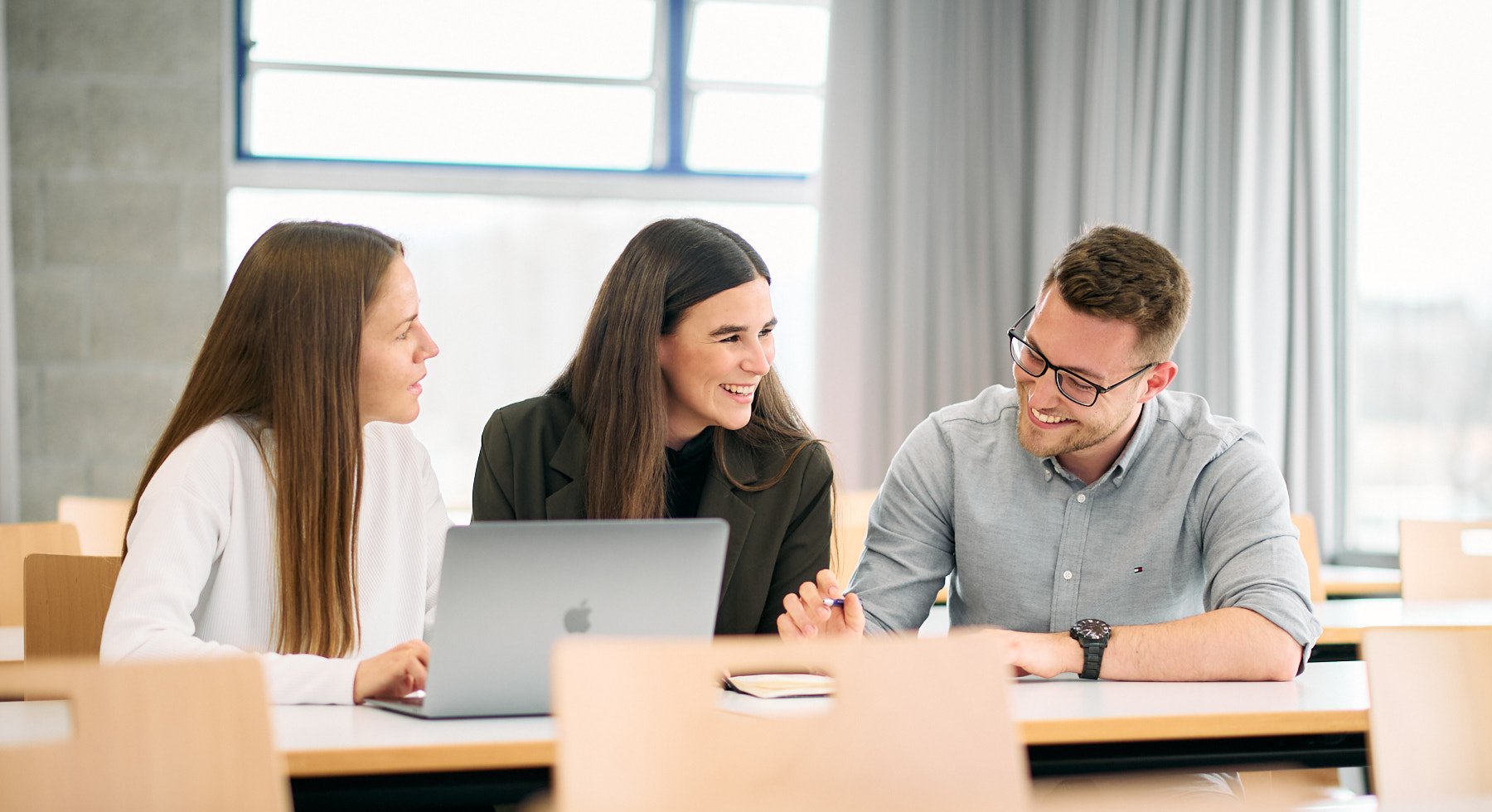 ESB Business School students chatting in a lecture room