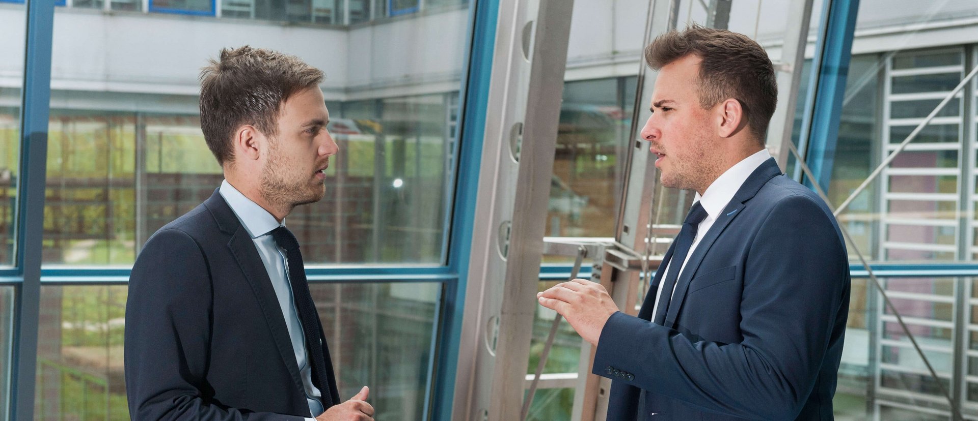 Students at the ESB Business School chatting in the hallway.