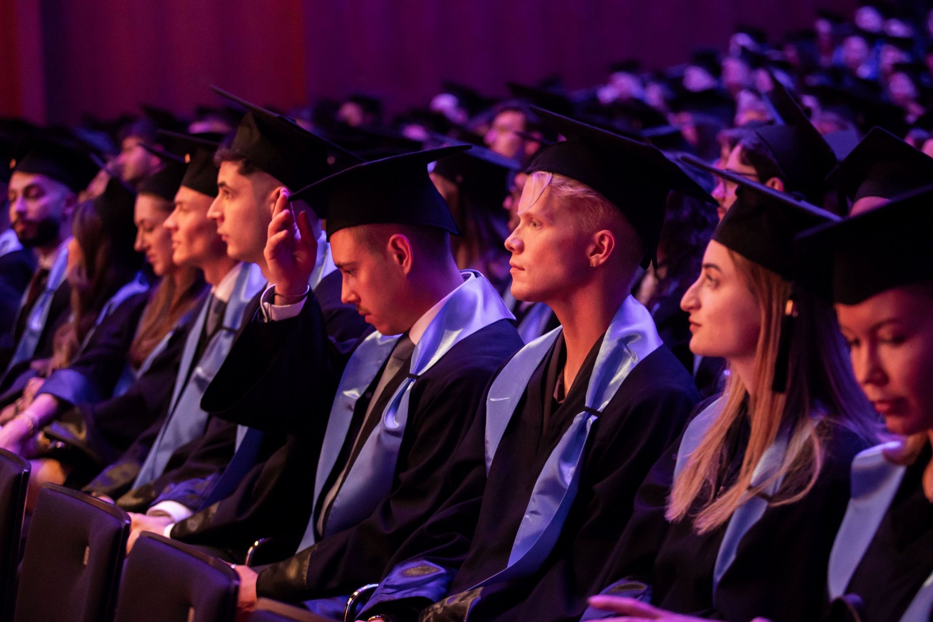 Former students listening to their laudatio